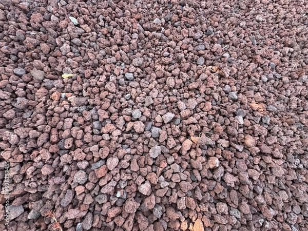 Fototapeta Slag Pumice natural stone decoration full frame background. volcano stone, red volcanic pumice with glass, cold piece of lava, basalt extrusive igneous rock, porous red volcano stones top view.