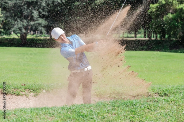 Fototapeta Yong asian golfer explosion sand.