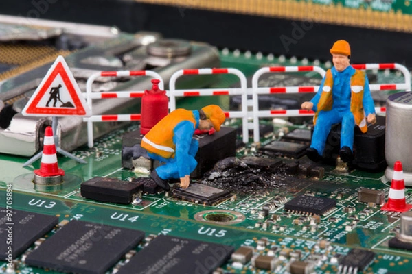 Fototapeta Arbeiter reparieren Mainboard