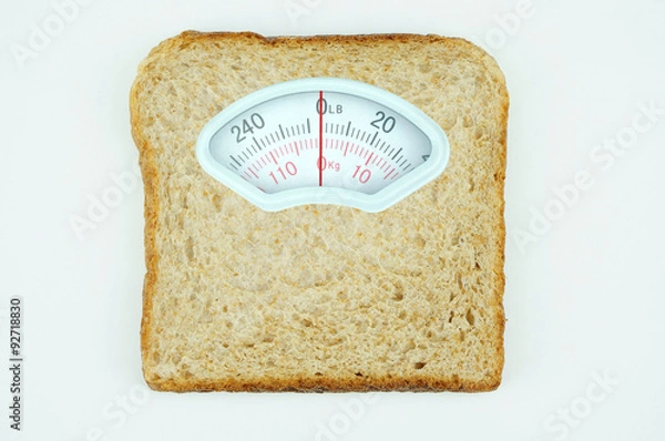 Obraz Weight scale with wholesome slice of bread on white background