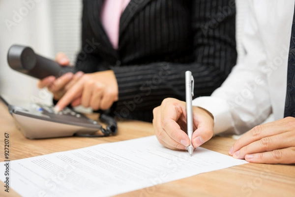 Fototapeta Business people are occupied with calling client or candidate an