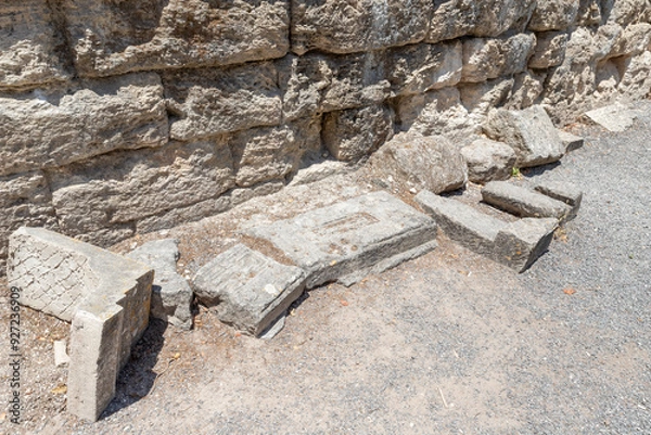 Fototapeta Fragments  of the stone burial slabs in ancient burial site of Beit Shearim Necropolis near Kiryat Tivon city in northern Israel