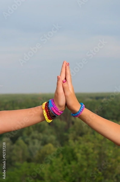 Fototapeta children's hands with colored bracelets