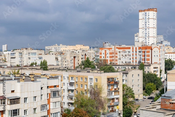 Fototapeta Summer urban landscape. Apartment buildings. Architecture of the city of Saratov, Russia. Clouds in the sky.