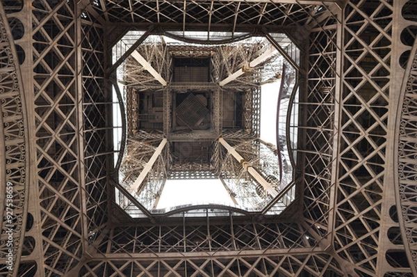 Fototapeta close-up of the metalwork of the eiffel tower. view of the bottom of the tower