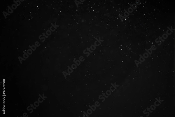 Fototapeta abstract real dust floating over black background for overlay