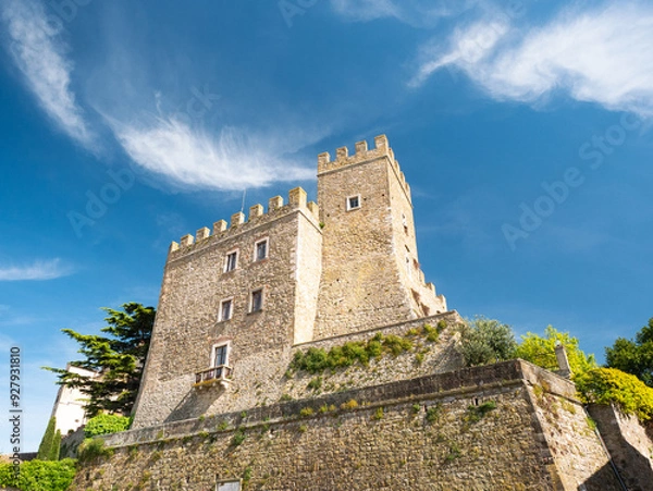 Fototapeta Medieval Manciano Castle: Tuscan Fortress Towering Against Azure Summer Sky