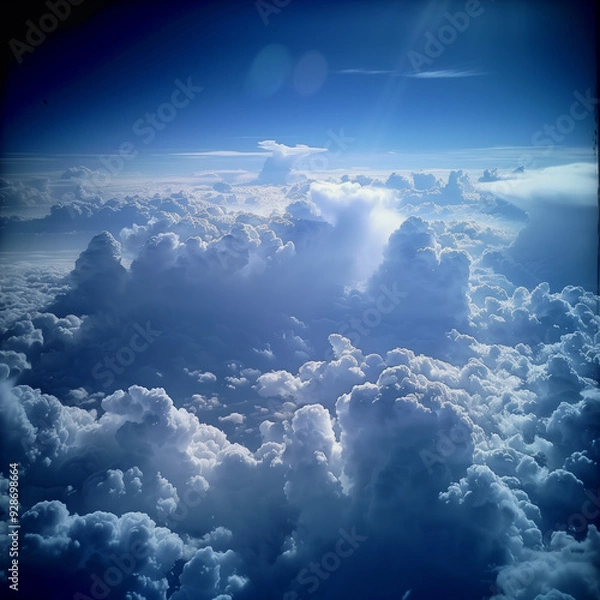 Fototapeta view from airplane window clouds above the sky