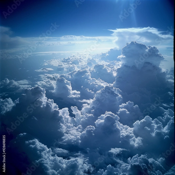 Fototapeta view from airplane window clouds above the sky