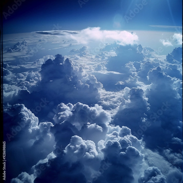 Fototapeta view from airplane window clouds above the sky