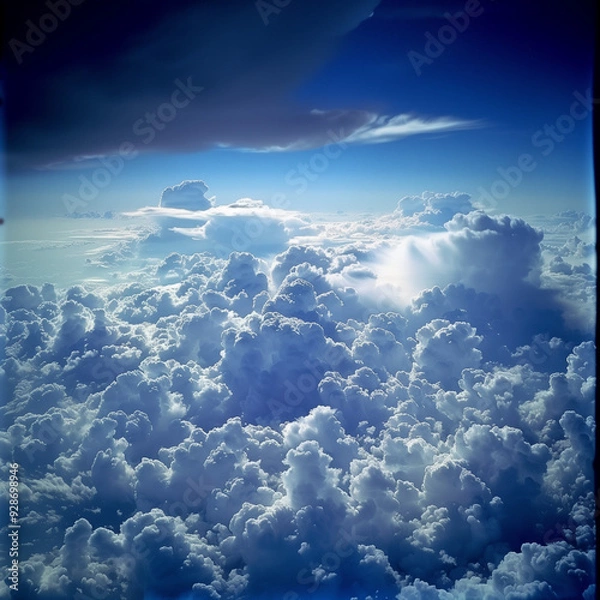 Fototapeta view from airplane window clouds above the sky