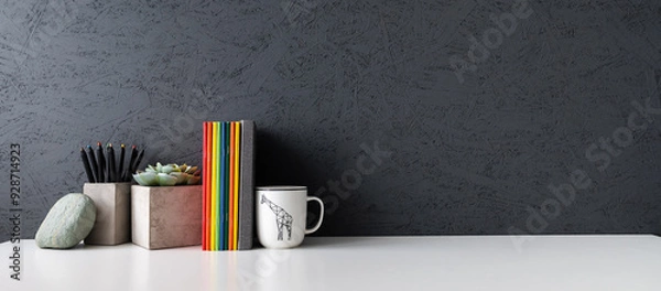 Obraz Home office desk with dark grey texture wall and white table mock up.	
