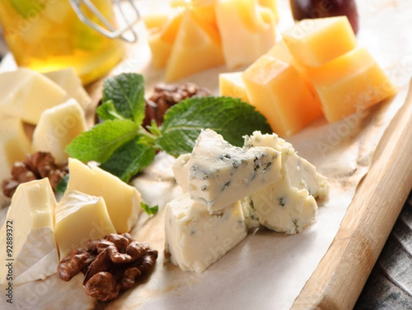 Obraz Assorted cheese on a wooden board