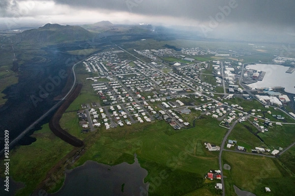 Obraz Grindavik Iceland with new lava flows coming over the road towards town