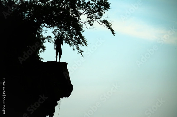 Obraz The man thinking something before cliff jump