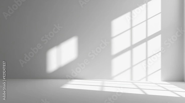 Fototapeta A minimalist interior with shadows cast by windows on a plain surface.