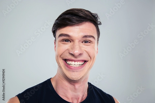 Fototapeta Portrait of a smiling man looking at camera