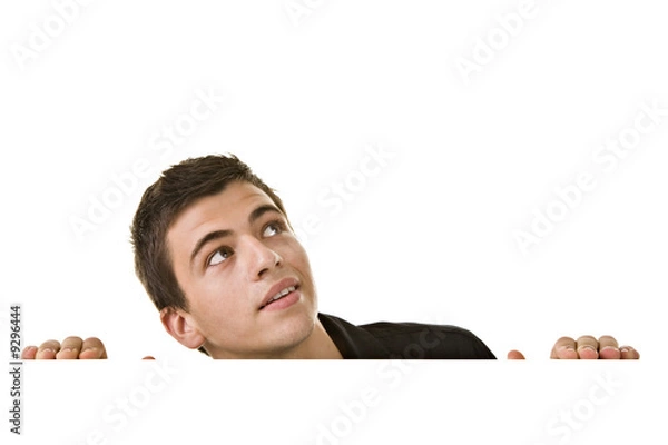 Obraz Handsome Young man, looking up with curious expression.