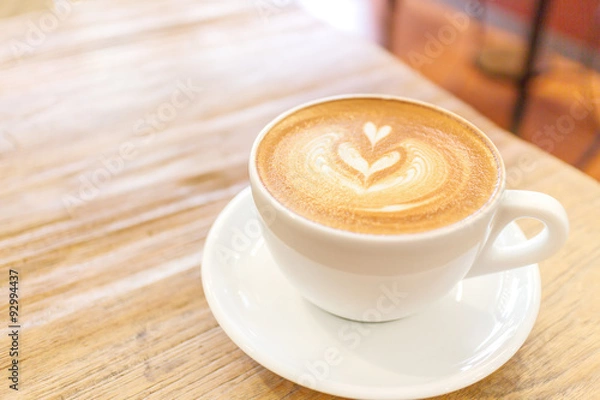Obraz Cup of coffee latte art on wood table
