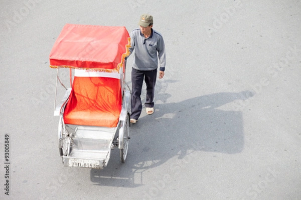 Fototapeta Hanoi, Vietnam, September 30 2014: Life in vietnam- Cyclo beside Sword lake in hanoi, vietnam. Cyclo is the tourist's farvourite vehicle transportation in vietnam