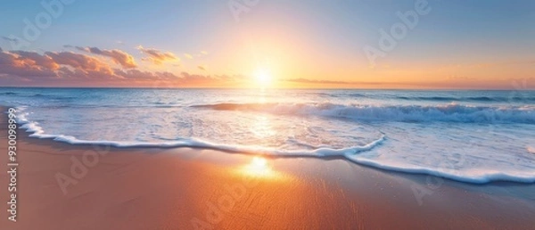 Fototapeta  The sun sets over the ocean, a wave advances toward the shore, and a beach lies in the foreground