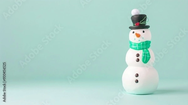 Obraz horizontal image of a cute toy snowman on the isolated blue background. Copy space for text.  For banner, design social media, blog, card, flyer, invitation, print, poster, 
