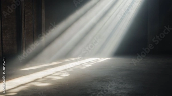 Obraz Warm sunlight streams through aged windows, casting long shadows on a worn wooden floor in an empty, atmospheric room.