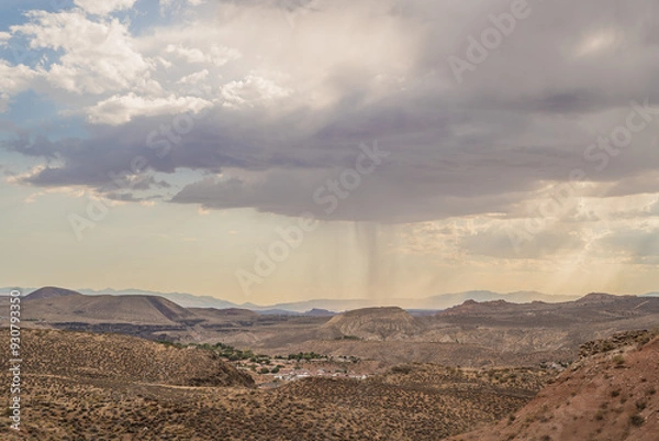 Fototapeta Rain in Distance Water Falling Clouds Over Desert Landscape