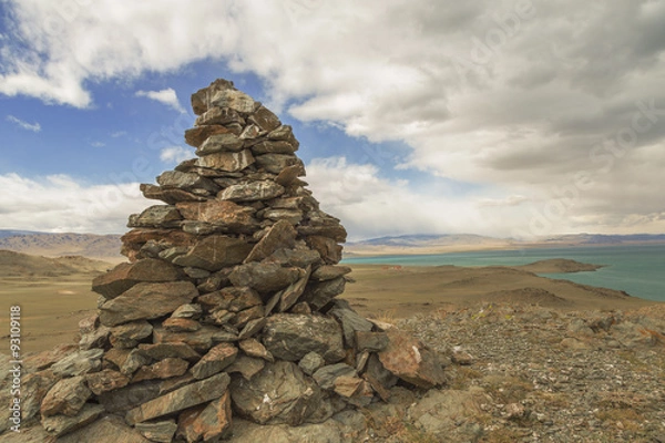 Fototapeta A pile of stones ritual on the lake Uureg Nuur in Mongolia