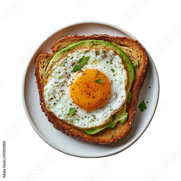 Fototapeta Fried egg and avocado on toast breakfast food concept with a healthy eating idea