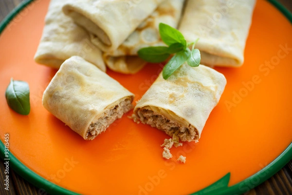 Obraz thin pancakes stuffed with meat