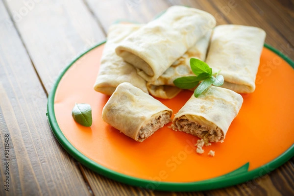 Obraz thin pancakes stuffed with meat