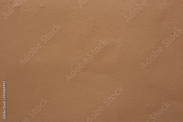 Fototapeta Soil wall texture of clay house structure with sunlight. Mud background
