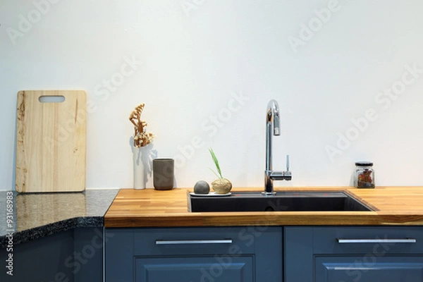 Obraz Modern sink with wooden cutting board in kitchen room