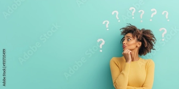 Fototapeta Woman in indecision, surrounded by question mark, on blue background with copy space. Brainstorming and decision making, searching for answers.