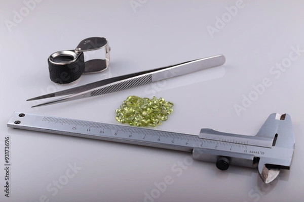 Fototapeta Natural peridot and tools gemologist.