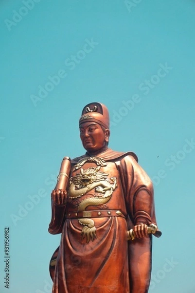 Fototapeta Statue of Admiral Cheng Ho (Zheng He) at Sam Poo Kong Temple, Semarang on a blue sky isolated