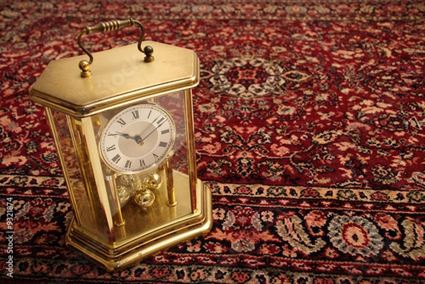Obraz Antique clock on persian rug