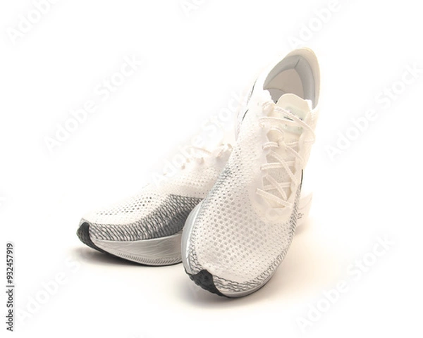 Fototapeta Rocker style racing shoes with stiff front soles, breathable upper mesh, light padding on tongue lace, responsive foam isolated on white background, super shoe pack smooth heel to toe transition