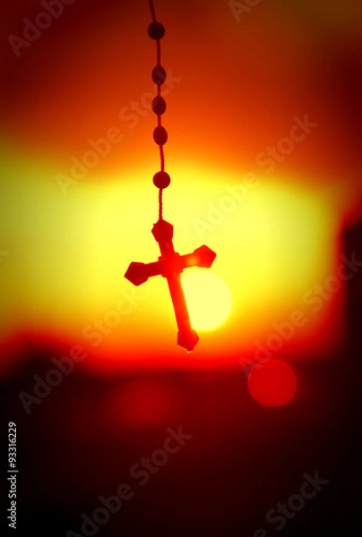 Obraz rosary beads with beautiful sunset background