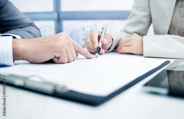 Obraz Female hand signing contract.