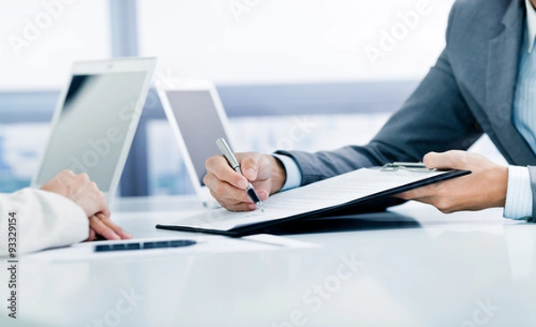 Obraz Female hand signing contract.