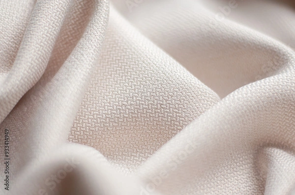Fototapeta Folds of beige textured fabric. Beige background of fabric.