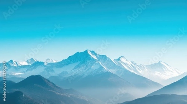 Fototapeta Impressive Mountain Range with Snow-Covered Peaks and Clear Sky