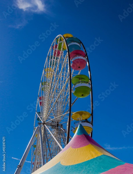 Obraz Ferris Wheel against blue sky at a Carnival