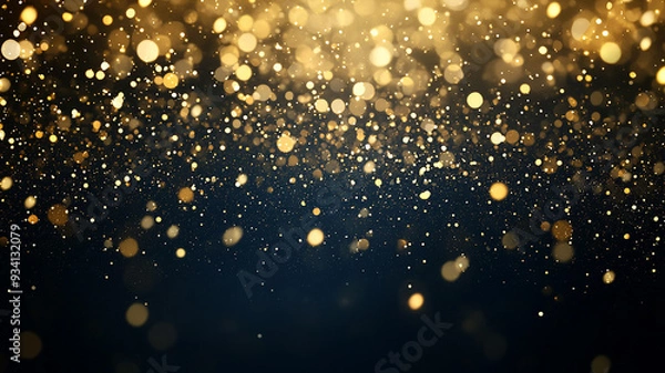 Fototapeta Gold glitter falling against a dark background.