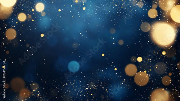Fototapeta Blue background with scattered gold glitter and bokeh.