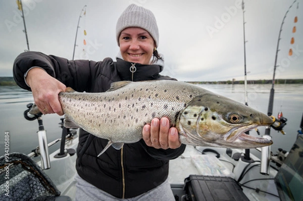 Obraz Women angler with a big lake trout