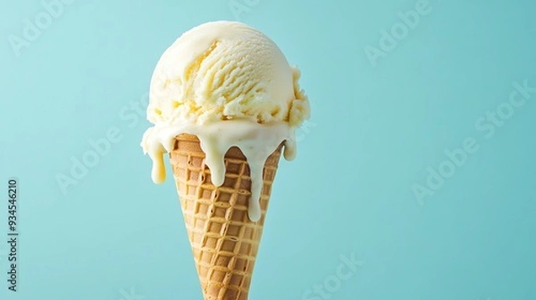 Obraz A melting ice cream cone with a light blue background.