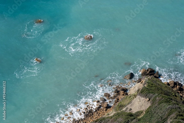 Fototapeta Rocks in the water on the coastline on the Island of Corfu in Greece.